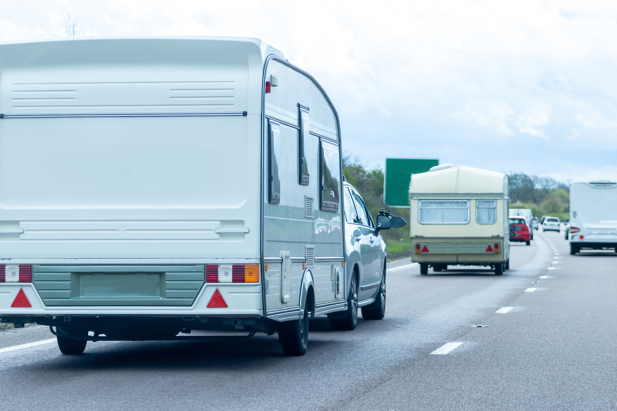An image of a couple of caravans on the motorway