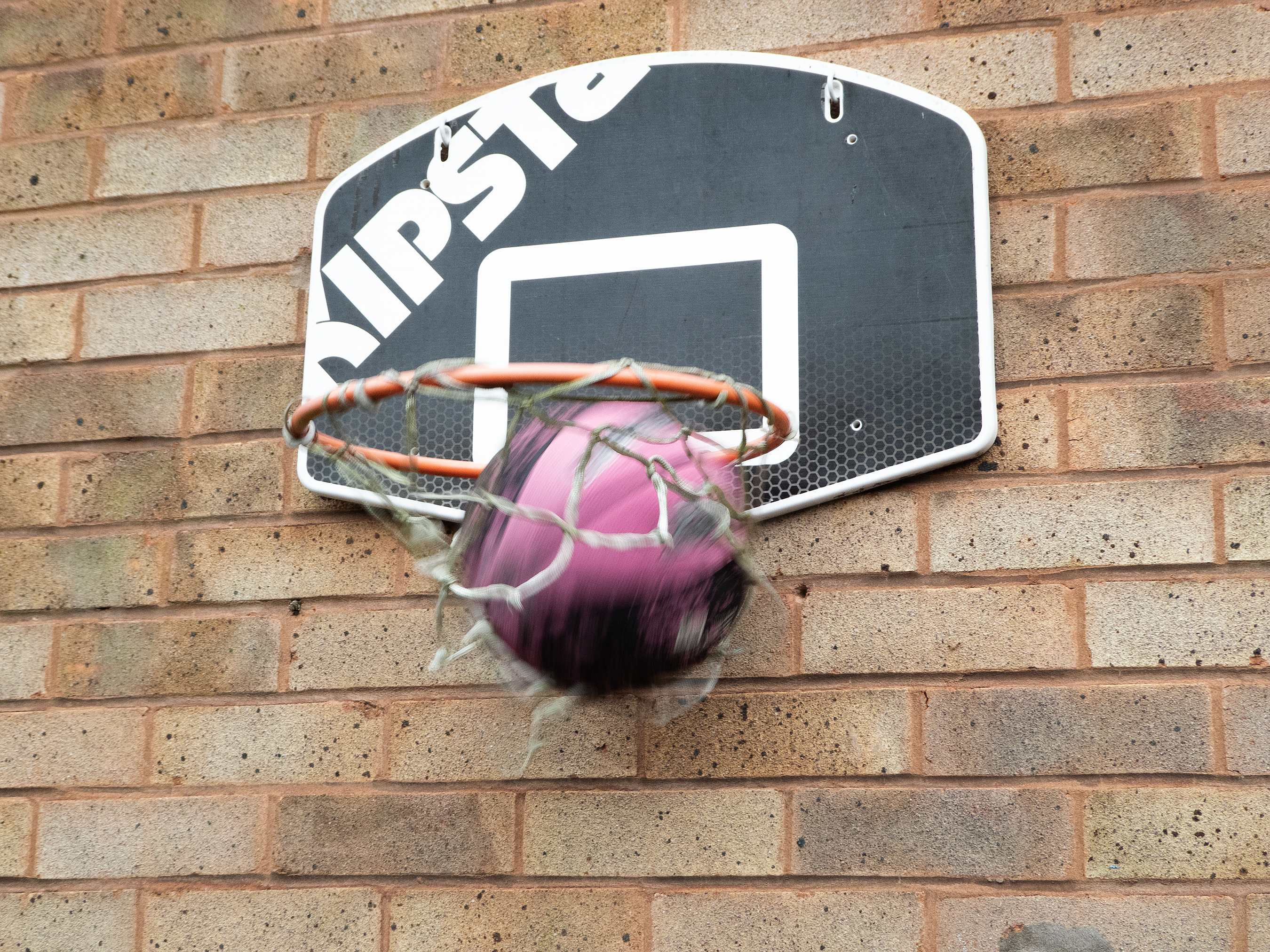 A basketball fall through a hoop